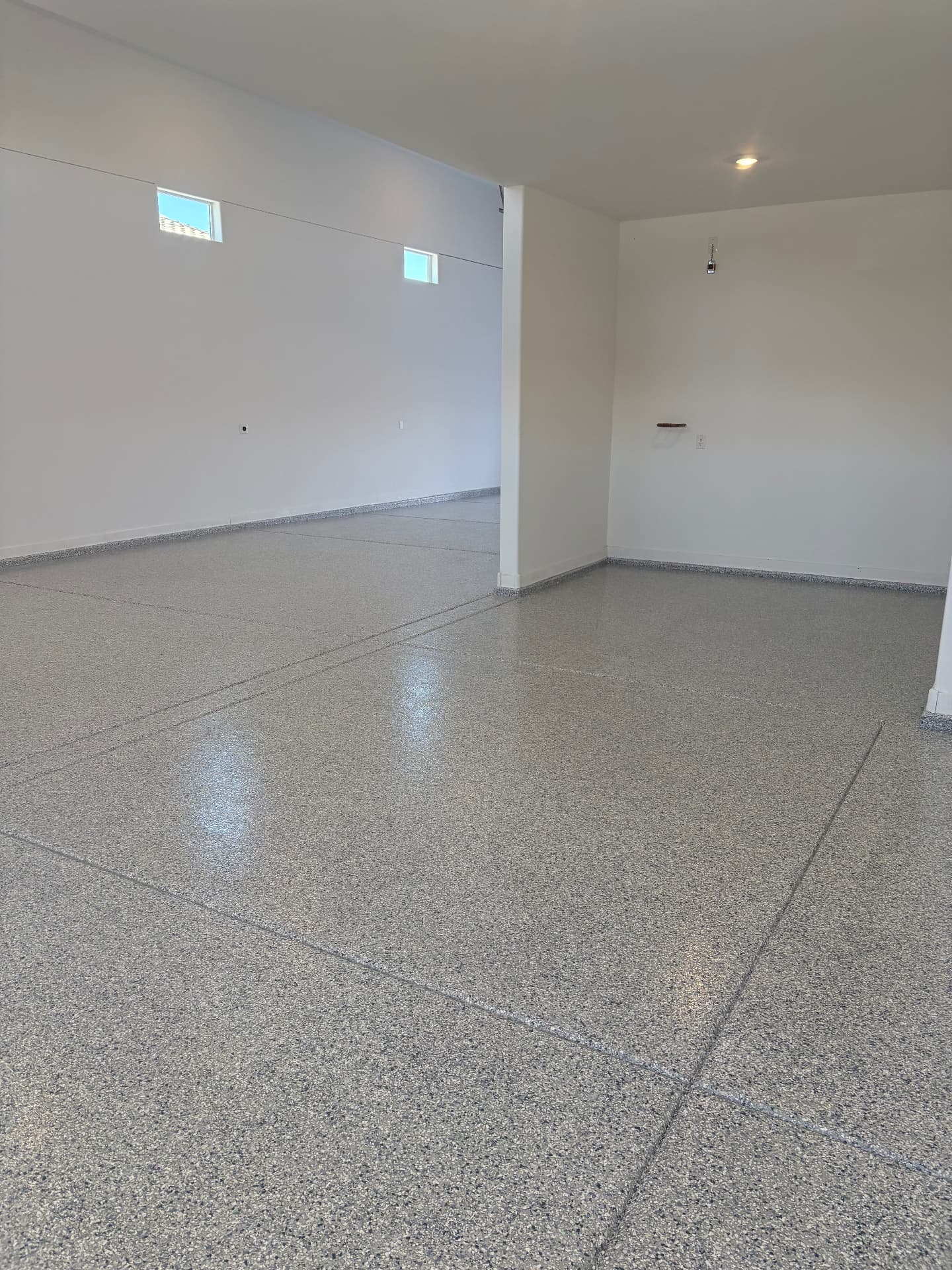 A pristine residential garage floor coated by The Garage Monkey